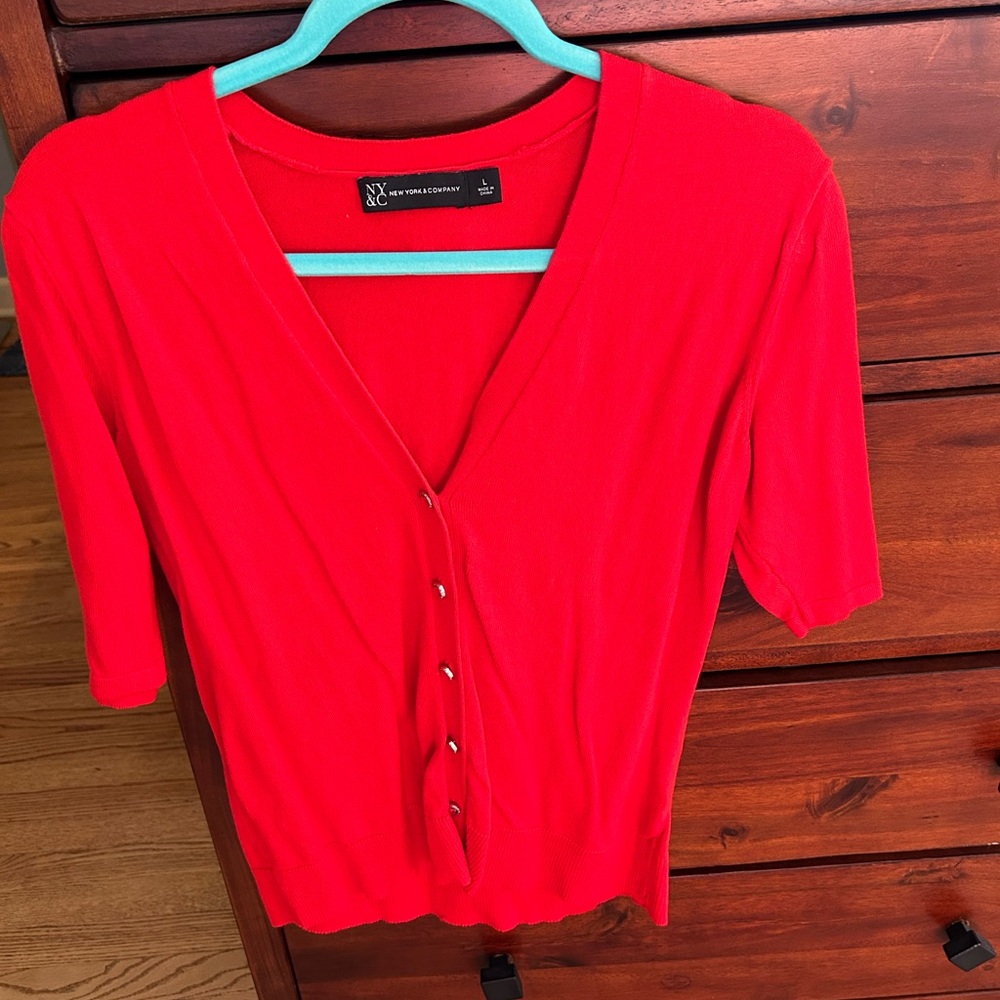 Short sleeved 100 cotton.  Large.  Great for covering sleeveless dresses.